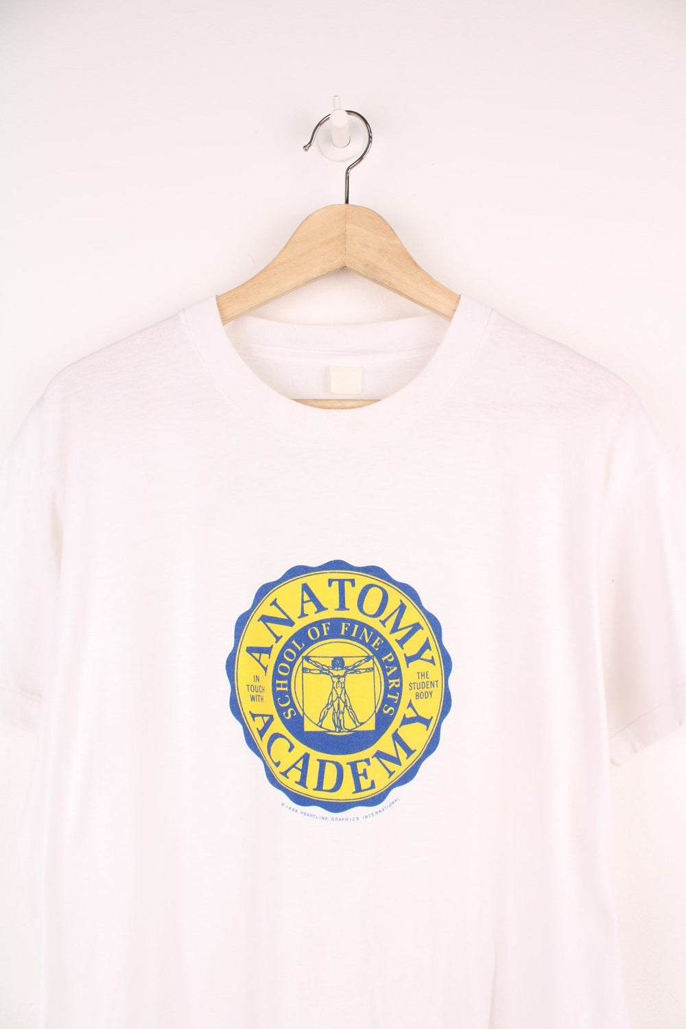 1988 Anatomy Academy tee with Vitruvian man graphic and blue and yellow seal logo reading 'Anatomy Academy - School of Fine Parts, in touch woth the student body'. 