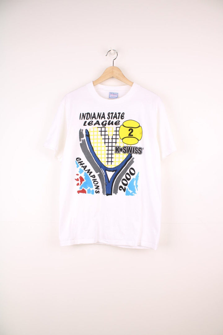 2000 'Indiana State League Champions' white spellout graphic tee with tennis racket and ball design and K. SWISS sponsor logo. Back graphic reading 'USA league tennis presented by Infiniti'.  