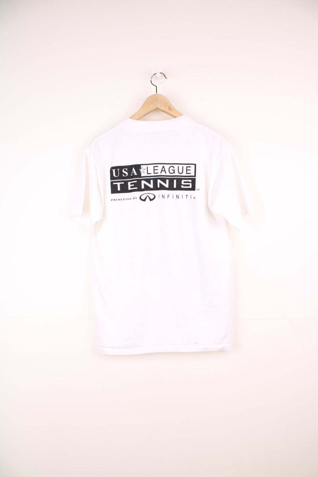 2000 'Indiana State League Champions' white spellout graphic tee with tennis racket and ball design and K. SWISS sponsor logo. Back graphic reading 'USA league tennis presented by Infiniti'.  