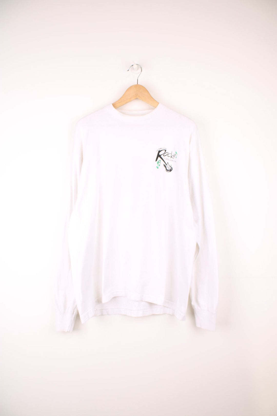 Vintage 1995 "Rokin' Homecoming" long sleeve top, features printed spell-out graphic on the front and back 