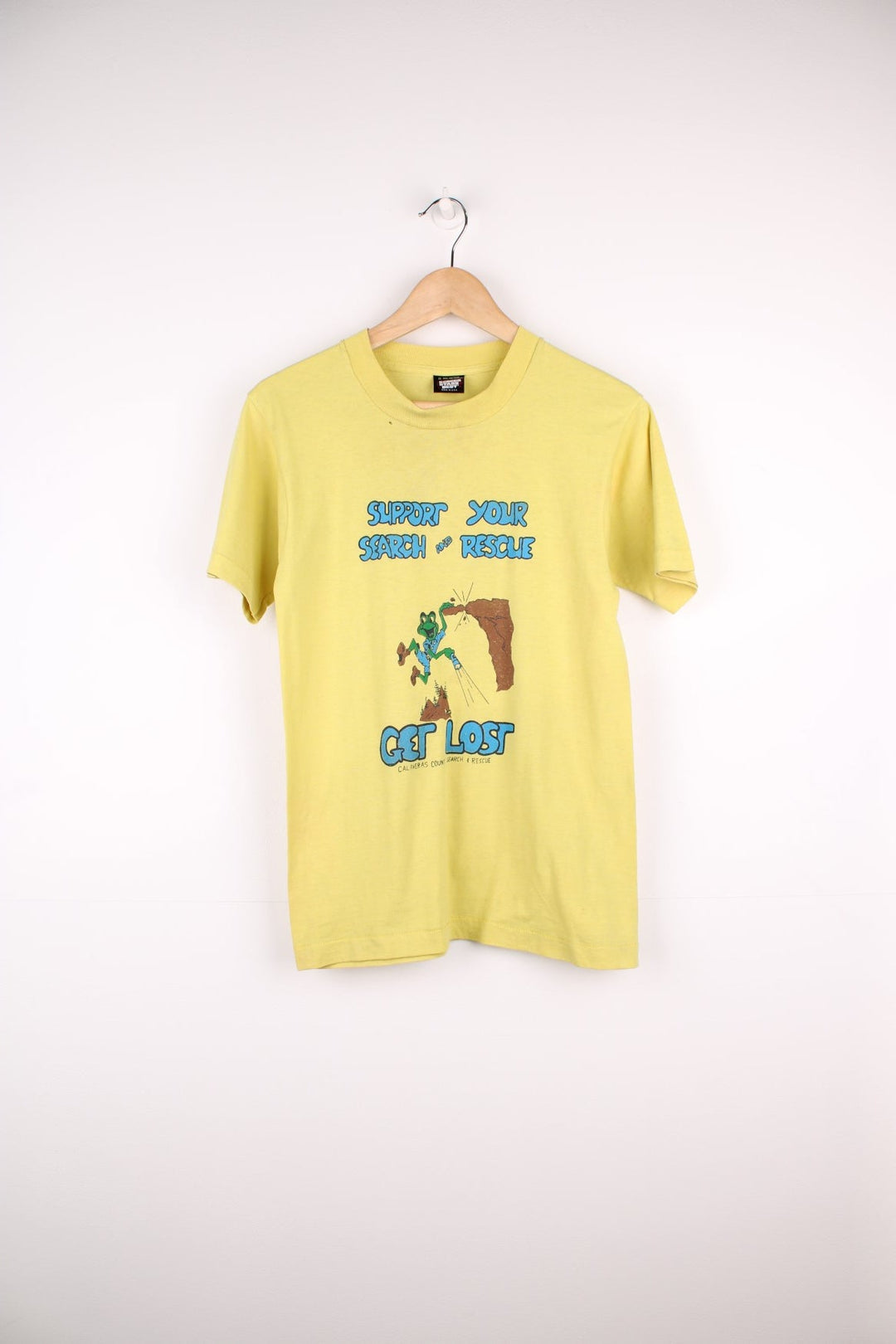 Vintage 80s Calaveras County Search & Rescue single stitch T-Shirt in yellow with graphic print and "Support Your Search And Rescue Get Lost" text on the front.