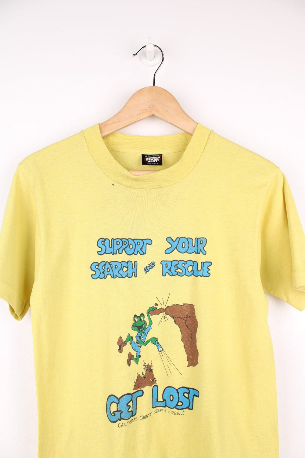 Vintage 80s Calaveras County Search & Rescue single stitch T-Shirt in yellow with graphic print and "Support Your Search And Rescue Get Lost" text on the front.