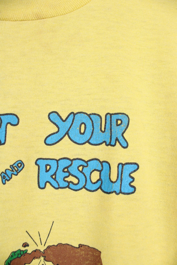 Vintage 80s Calaveras County Search & Rescue single stitch T-Shirt in yellow with graphic print and "Support Your Search And Rescue Get Lost" text on the front.