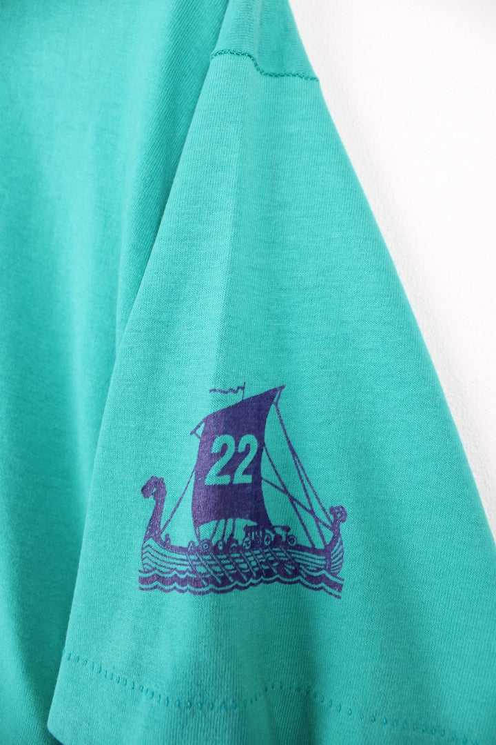 Vintage 90s Syttende Mai Run, Stoughton Wisconsin single stitch T-Shirt in a turquoise green and purple colourway.