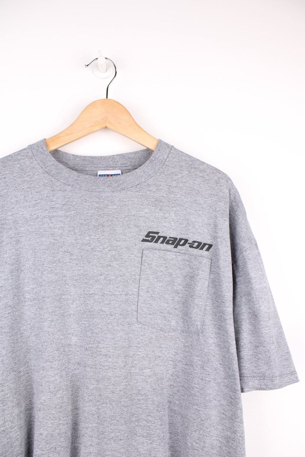 Snap-On T-Shirt in grey with pocket and printed logo on the chest, and large graphic sun print on the back.