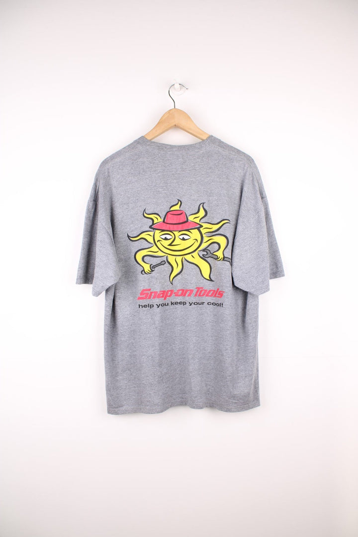 Snap-On T-Shirt in grey with pocket and printed logo on the chest, and large graphic sun print on the back.