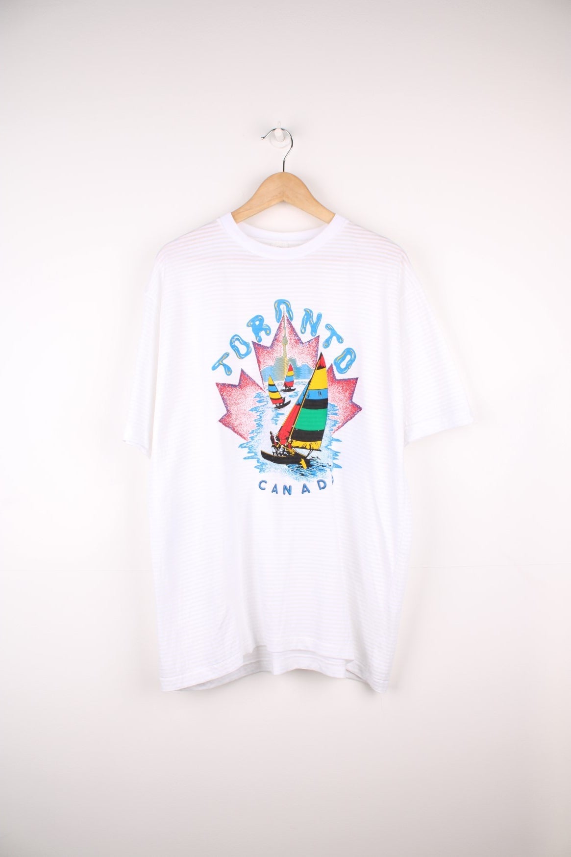 90s Toronto Canada graphic T-Shirt in white with a ribbed stripe.