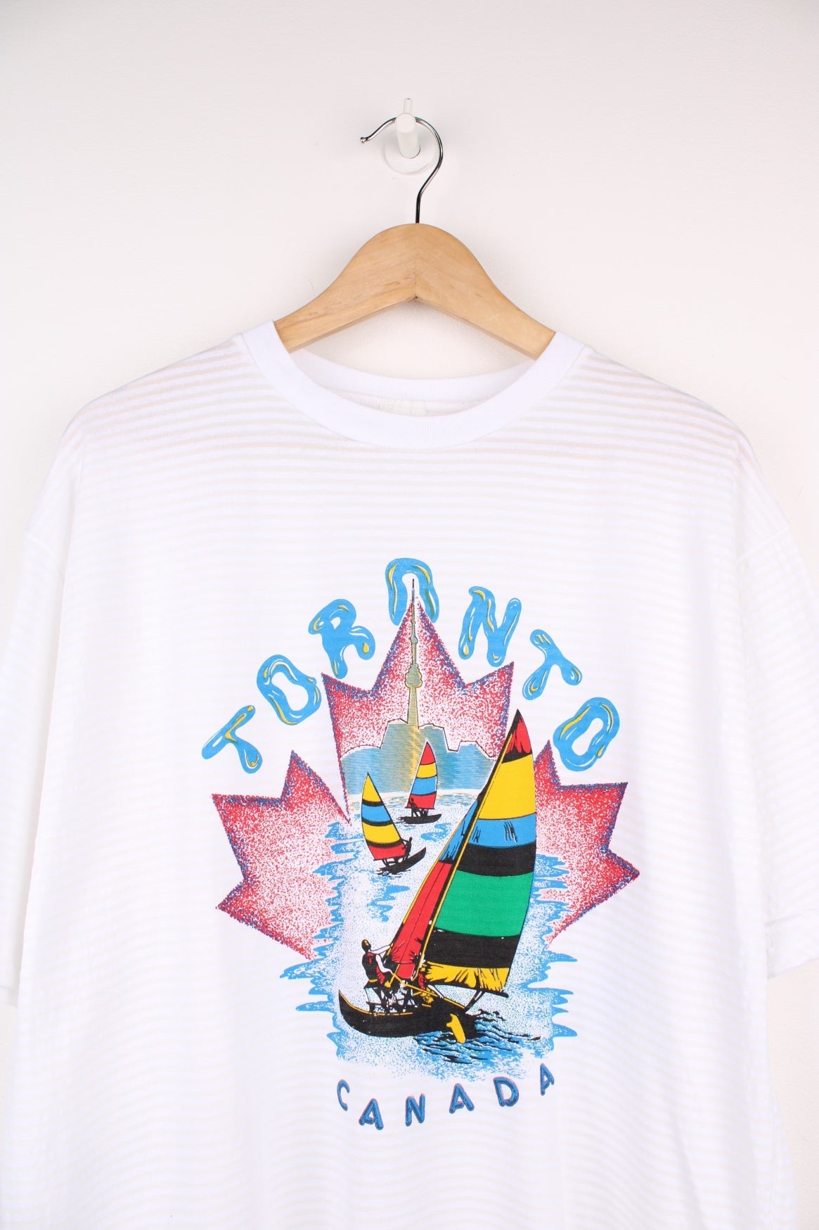 90s Toronto Canada graphic T-Shirt in white with a ribbed stripe.