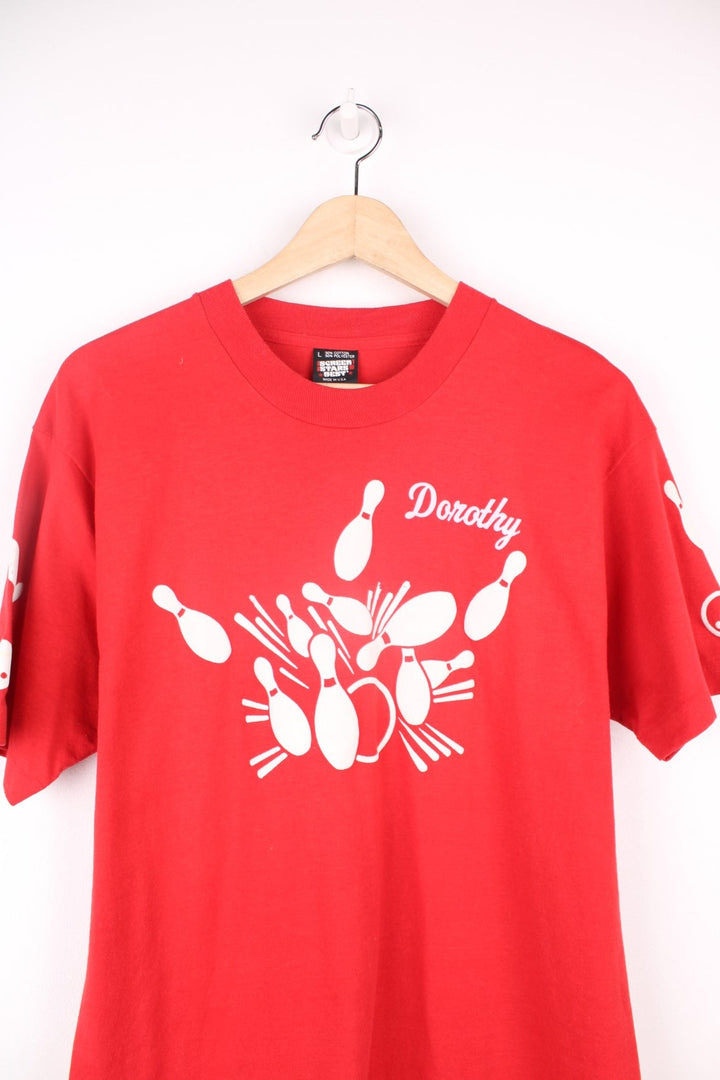 Vintage 80s red single stitch T-Shirt with bowling pin and "Dorothy" print in white.