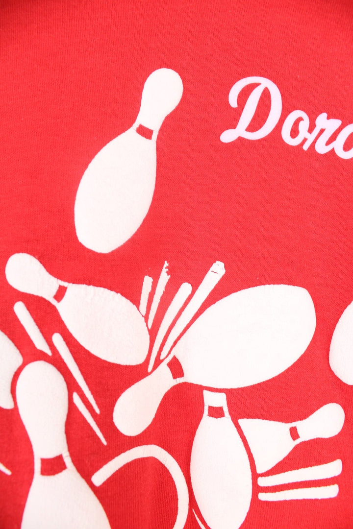 Vintage 80s red single stitch T-Shirt with bowling pin and "Dorothy" print in white.