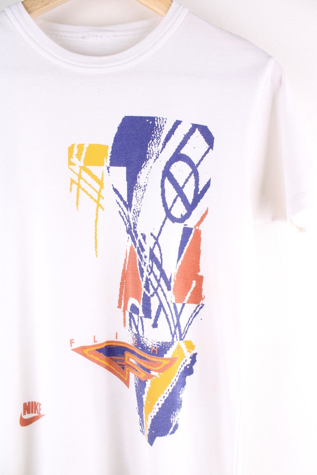 Vintage 90s Nike Flight T-Shirt in a white colourway with a large graphic on the front, and single stitch hem.  