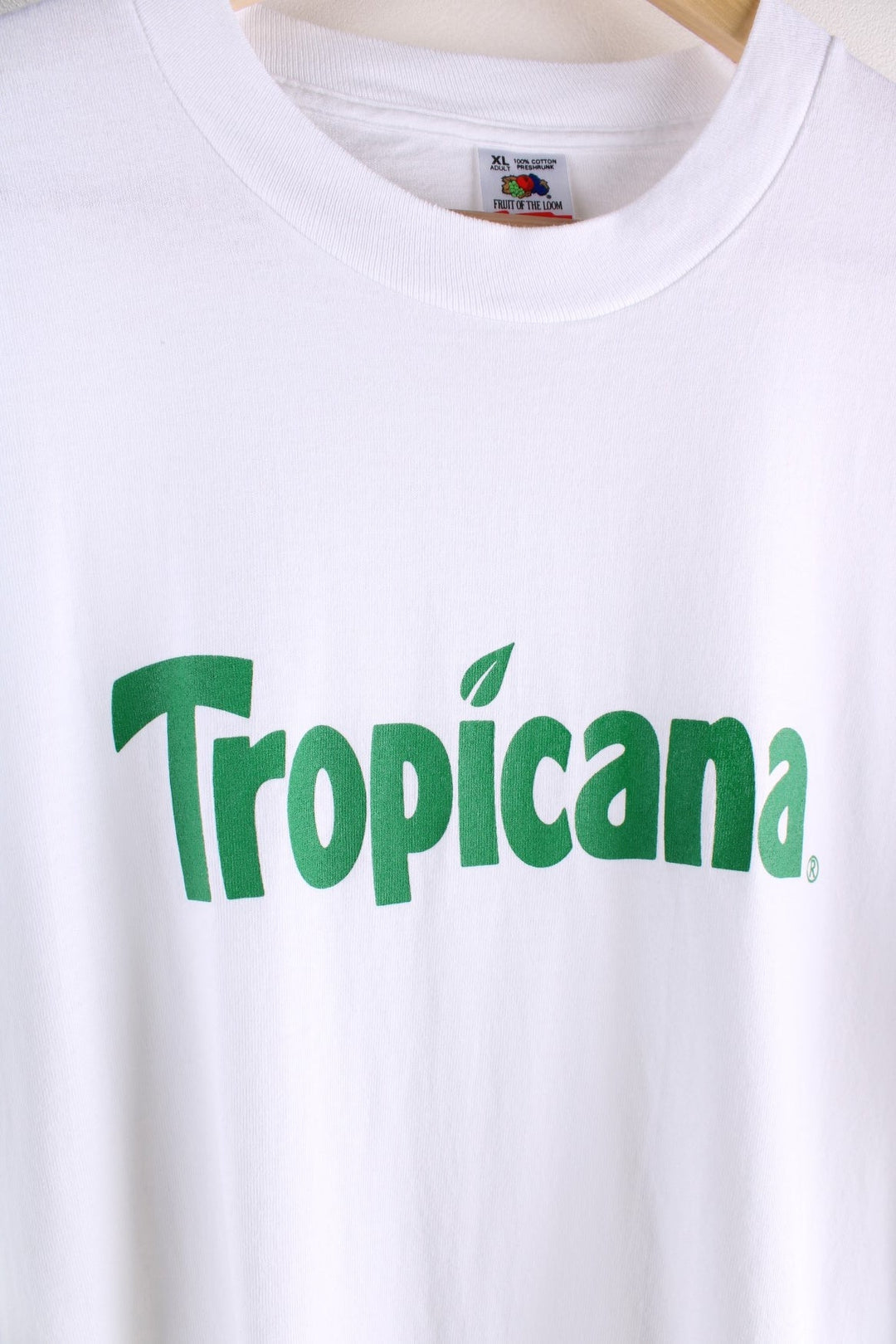 Vintage 1990s  Fruit of the Loom / Tropicana T-Shirt in a  colourway with the Tropicana logo screen printed on the front. Single Stitch, made in the USA.  