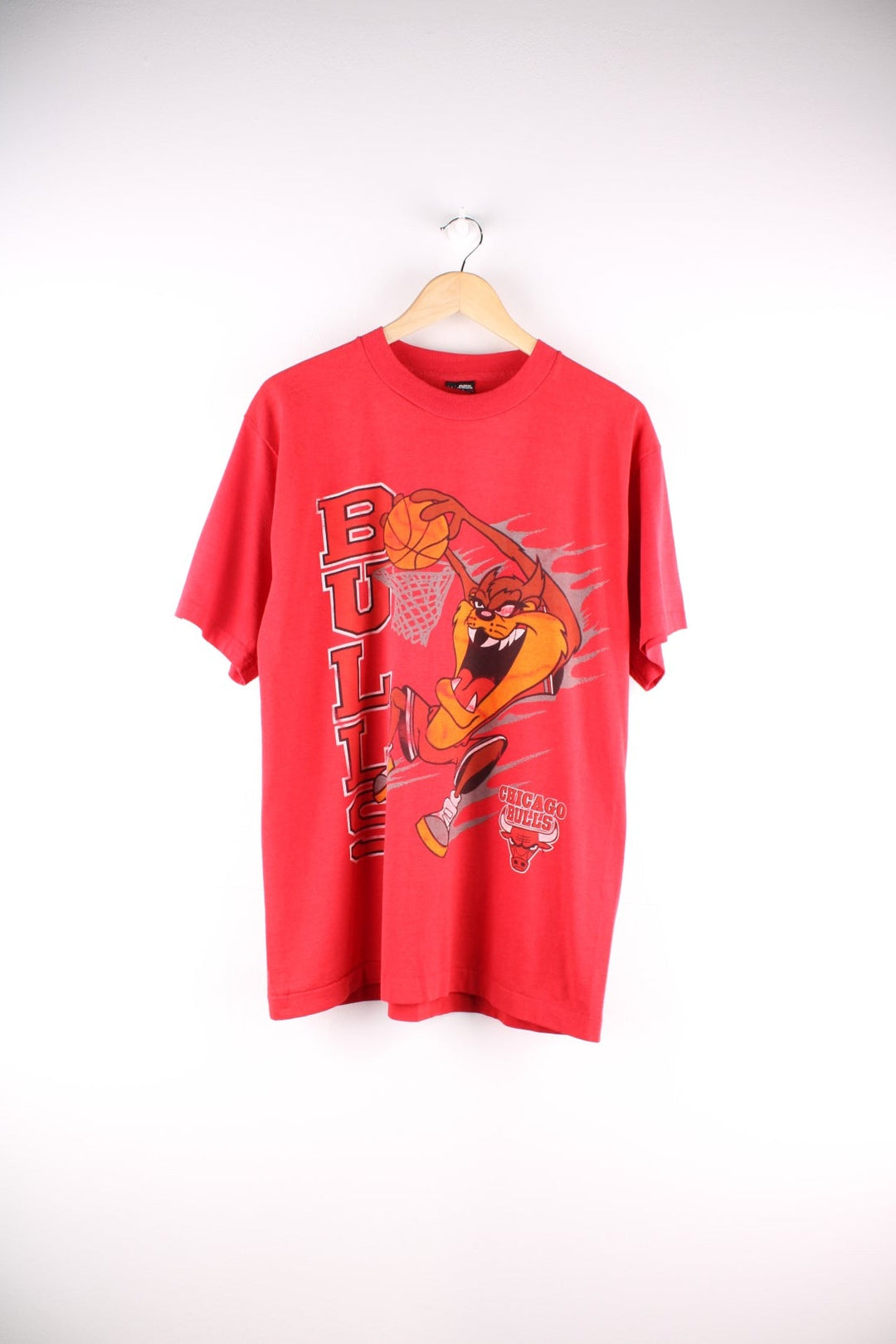 Vintage 1990s Chicago Bulls / Taz Looney Tunes T-Shirt in a red colourway. The shirt has a large graphic printed on the front.   