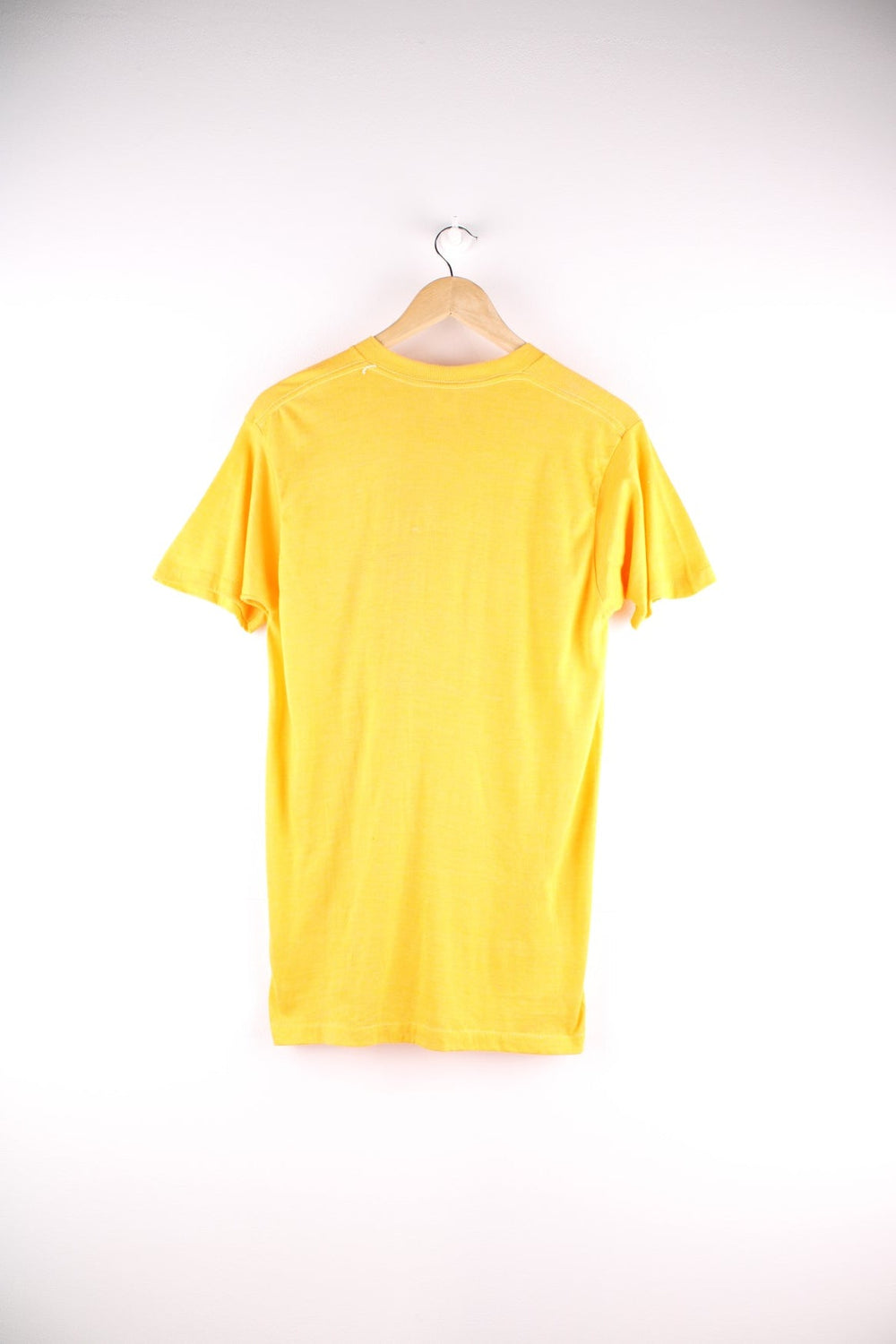 Vintage Screen Stars graphic T-Shirt in a yellow colourway. The shirt has a large red slogan printed on the front. Made in the USA. 