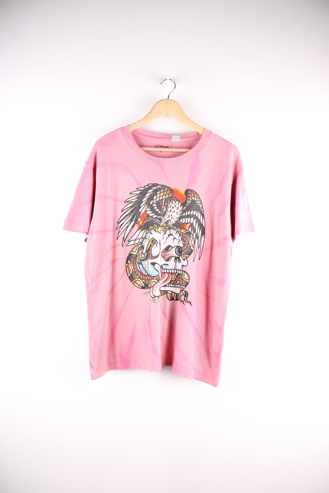 Vintage Ed Hardy T-Shirt in a pink colourway with a large skull, eagle and snake graphic on the front, 'painted by Ed' on the back with a single stitch hem.  