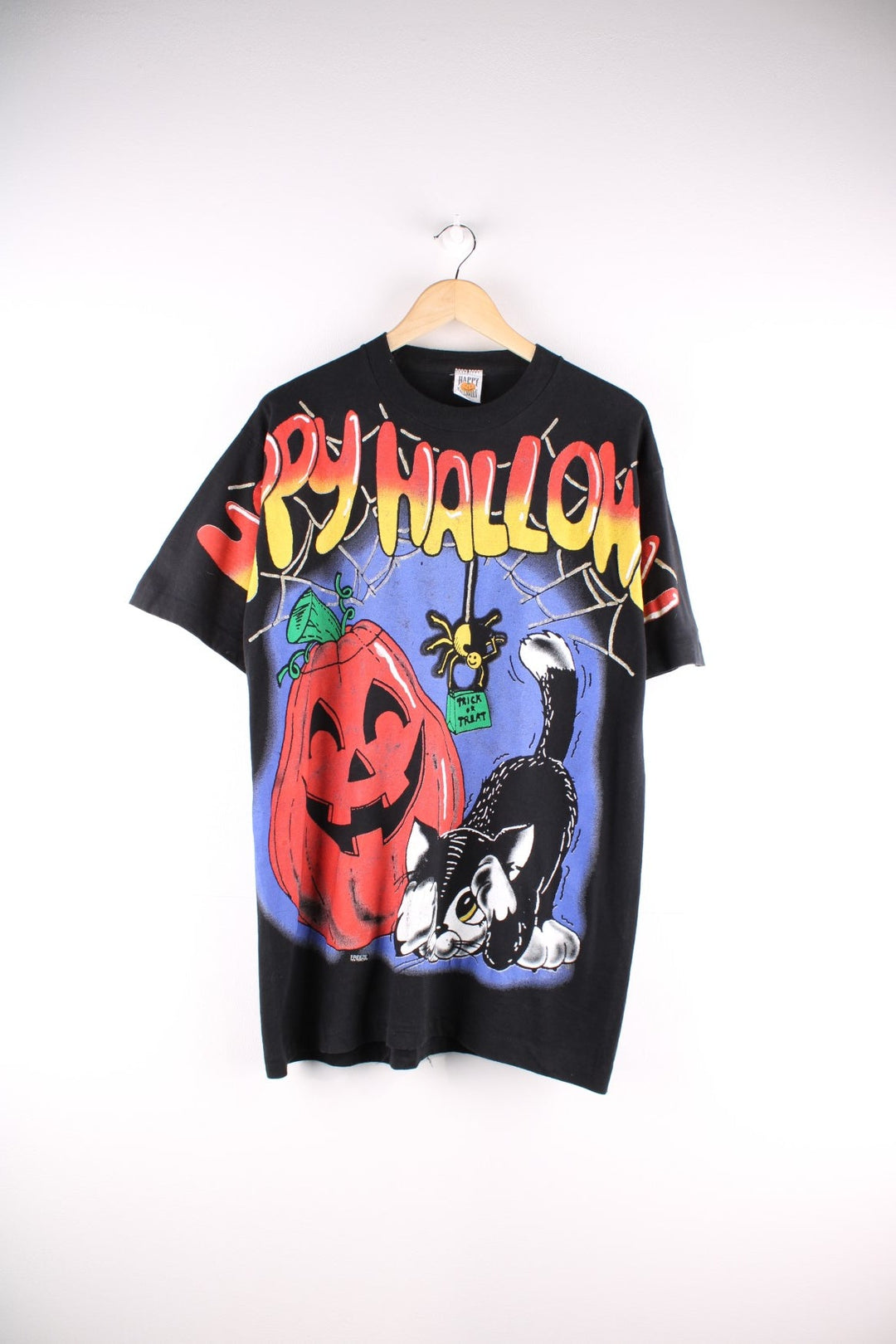 Vintage Freeze Happy Halloween single stitch T-Shirt in black. The T Shirt has a halloween themed image on the front panel and sleeves. Made in the USA and dated to 1996. 