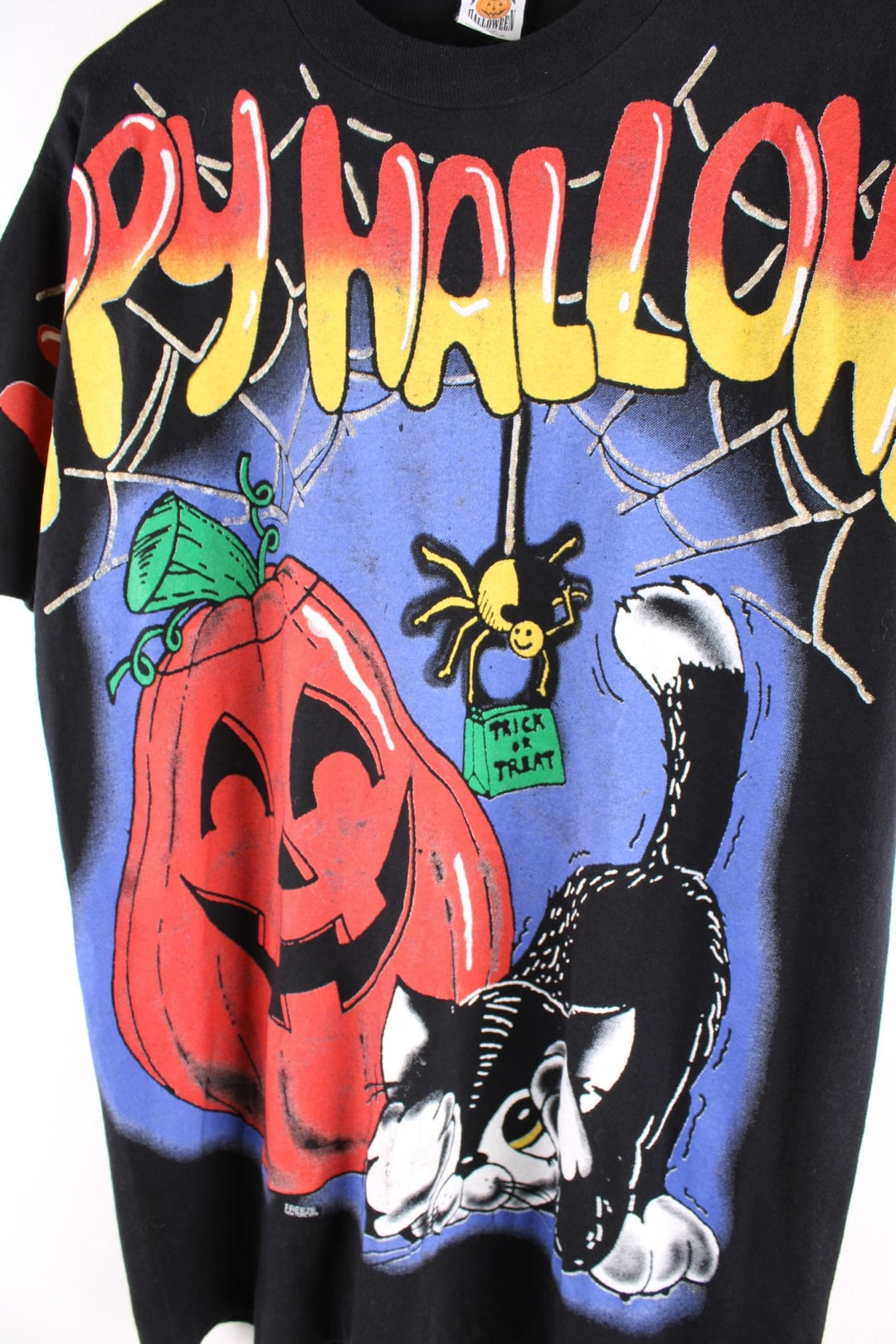 Vintage Freeze Happy Halloween single stitch T-Shirt in black. The T Shirt has a halloween themed image on the front panel and sleeves. Made in the USA and dated to 1996. 