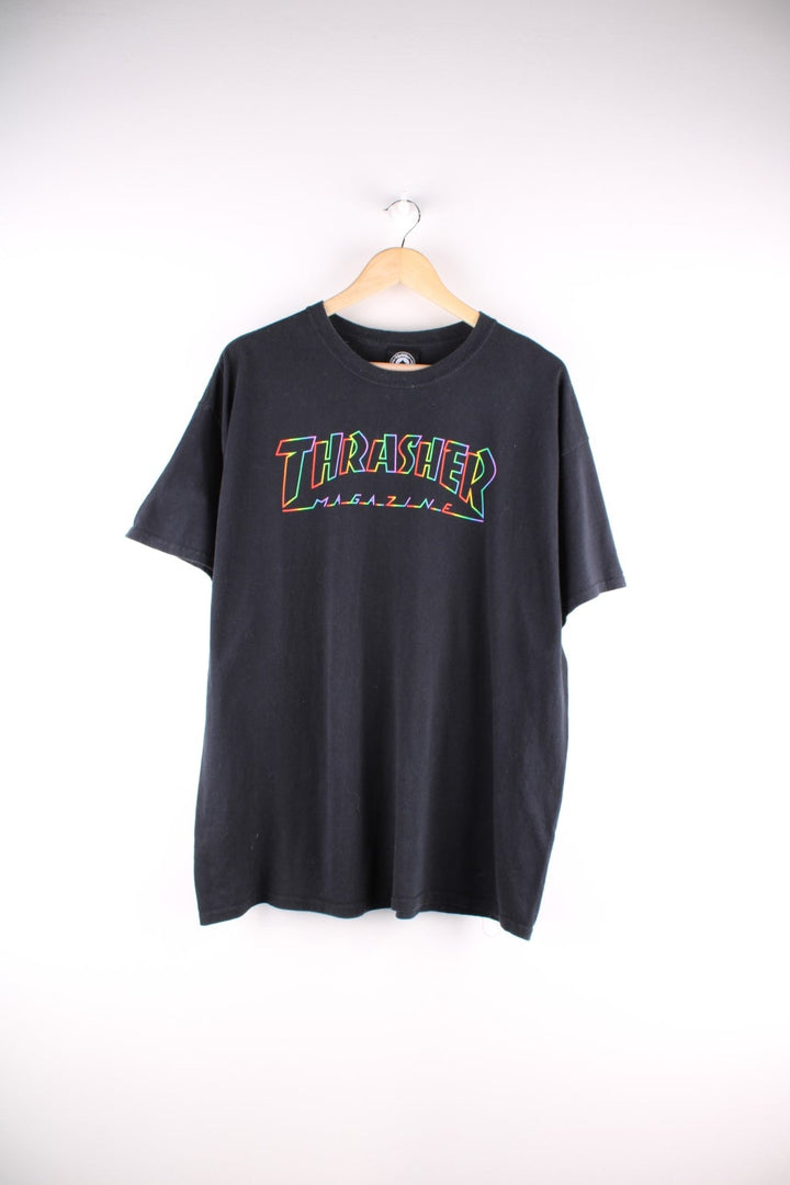 Thrasher T Shirt in black. The shirt has the classic Thrasher logo on the front, in a neon rainbow colourway. 