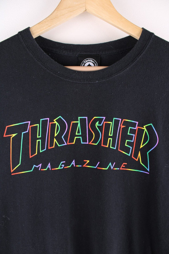 Thrasher T Shirt in black. The shirt has the classic Thrasher logo on the front, in a neon rainbow colourway. 