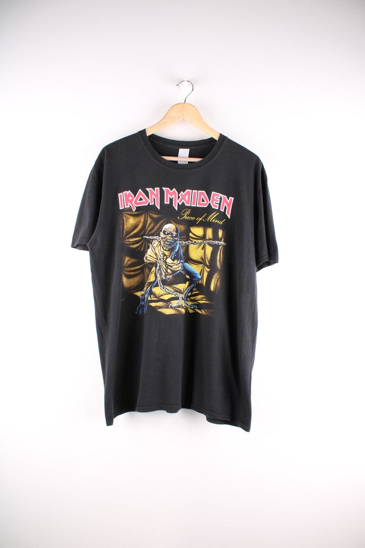 Vintage Iron Maiden band T-Shirt in black The shirt has a large graphic on the front of the album artwork for Iron Maiden's 1984 album 'Piece of Mind'  