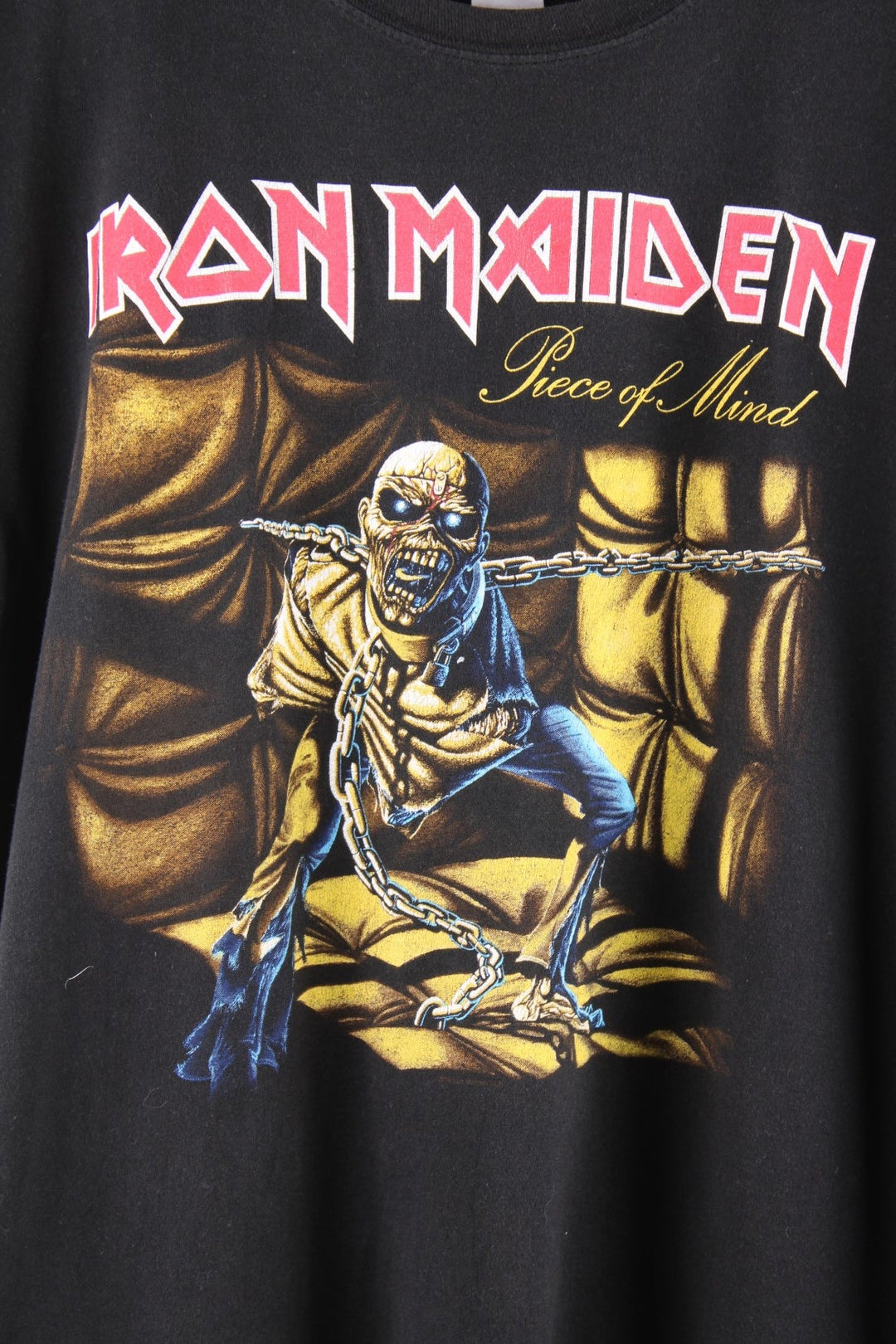 Vintage Iron Maiden band T-Shirt in black The shirt has a large graphic on the front of the album artwork for Iron Maiden's 1984 album 'Piece of Mind'  