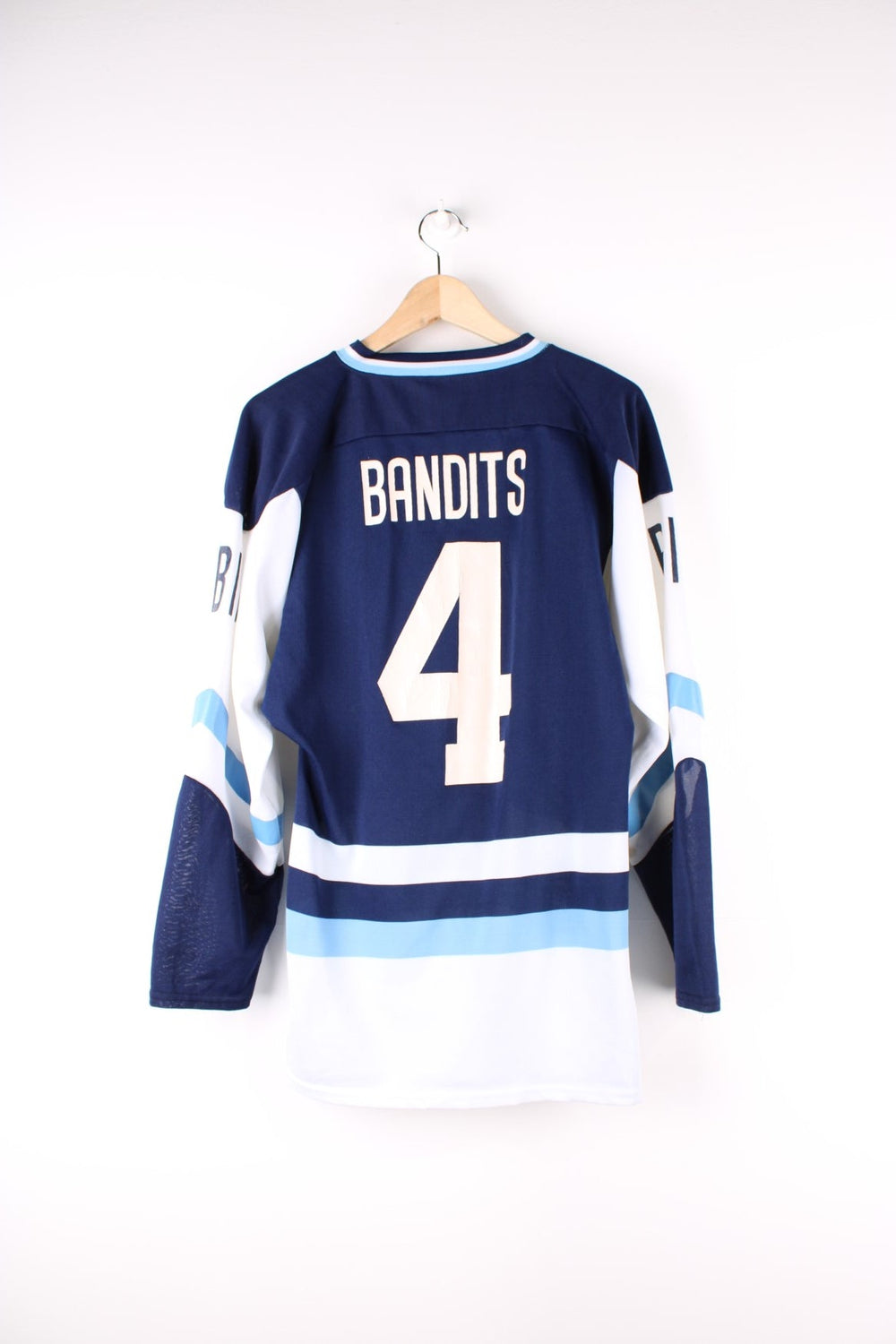 Vintage 90's Looney Tunes Bandit Hockey Jersey in a blue colourway with the bandit graphic printed on the front and on the back is Bandits number 4.