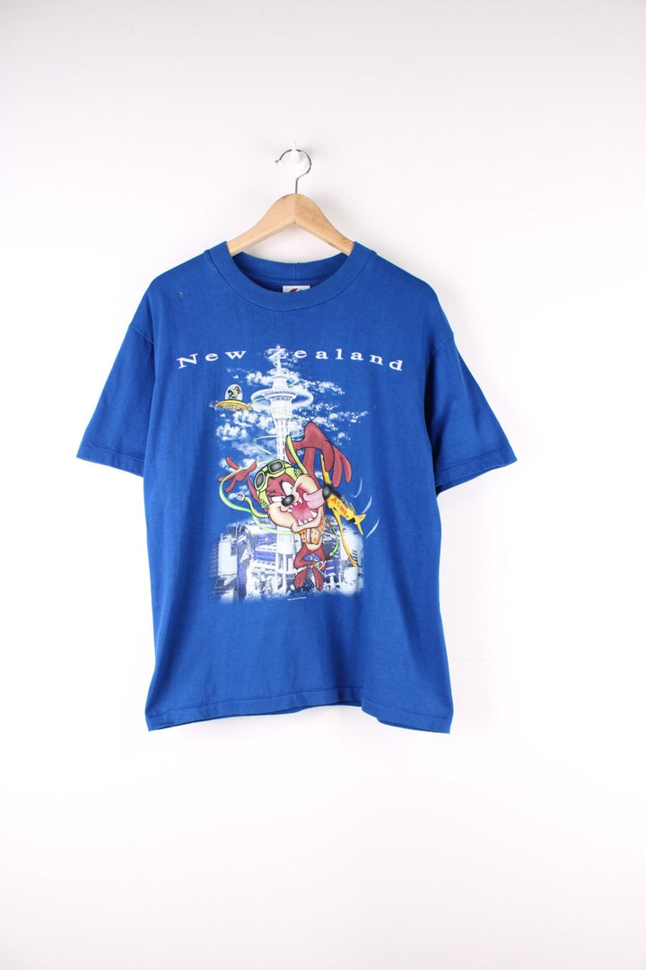 Vintage 90's Tazmanian Devil Looney Tunes New Zealand Single Stitch Graphic T-Shirt in a blue colourway graphic printed on the front.