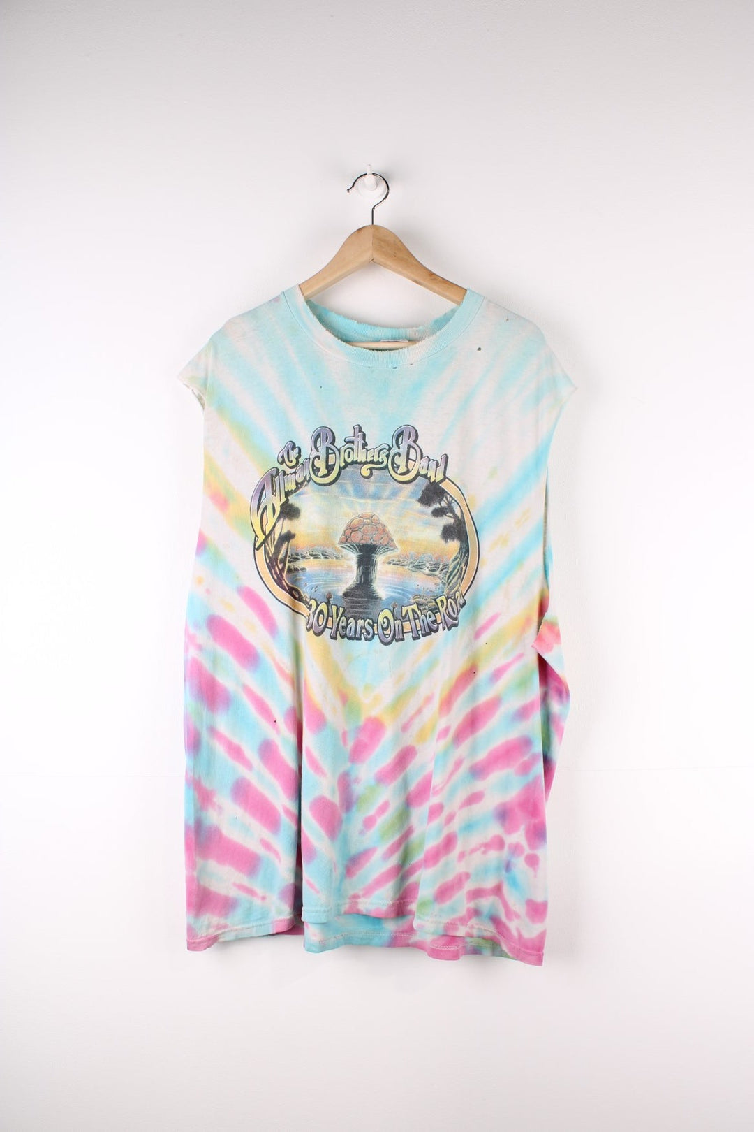 Vintage 90's The Allman Brothers Band 30 Years On The Road, Thrashed Vest in a multicoloured Tie Dye colourway a mushroom graphic printed on front and all the tour dates on the back.