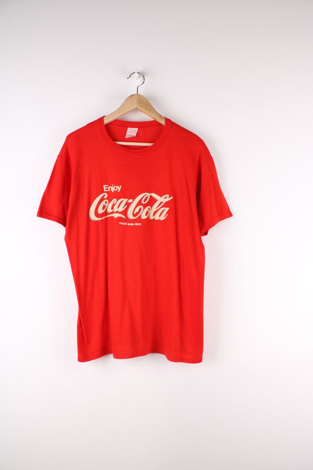 Vintage 80's Coca Cola Graphic T-Shirt in a red colourway with the spell out logo puff printed on the front.