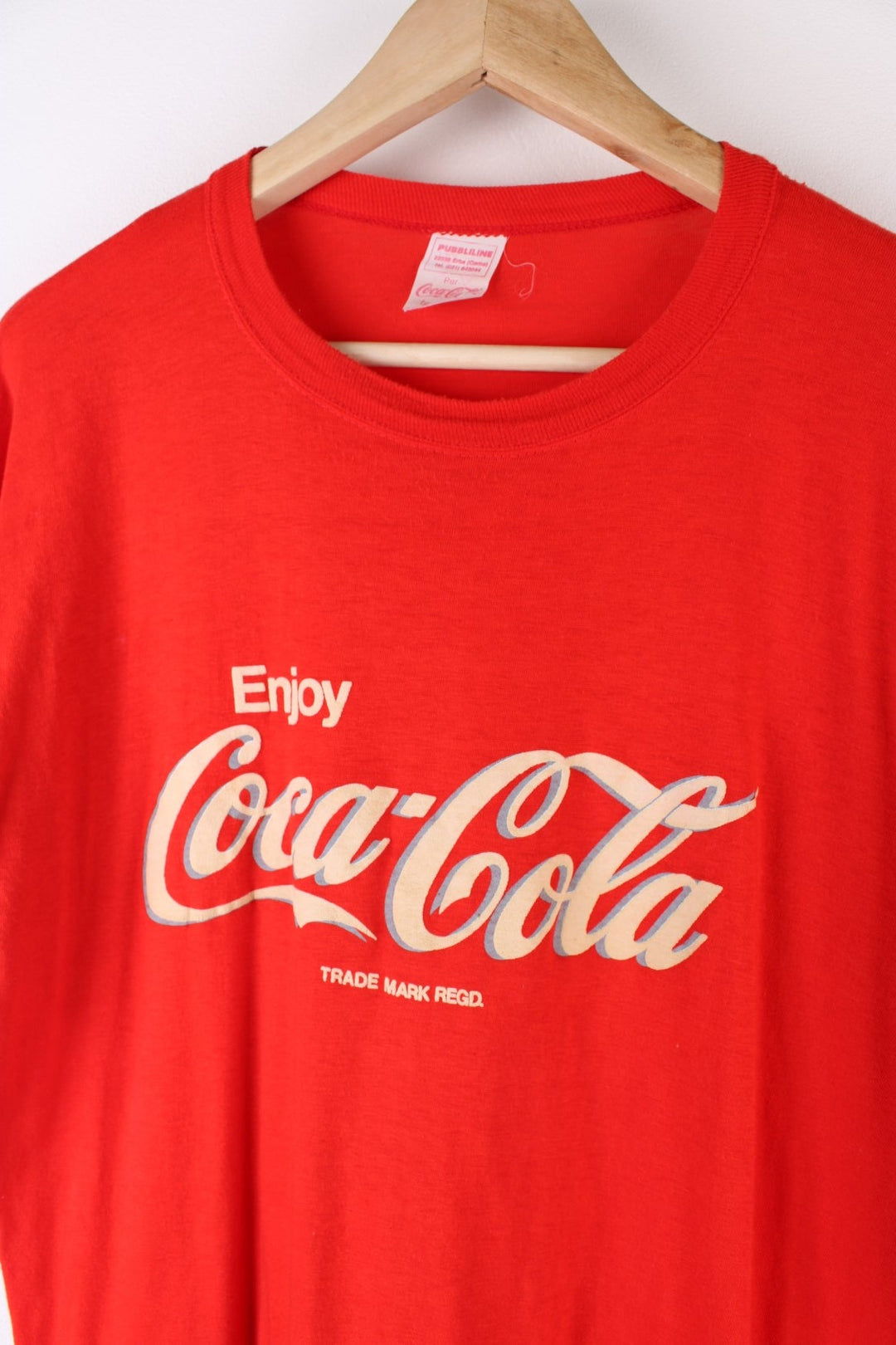 Vintage 80's Coca Cola Graphic T-Shirt in a red colourway with the spell out logo puff printed on the front.