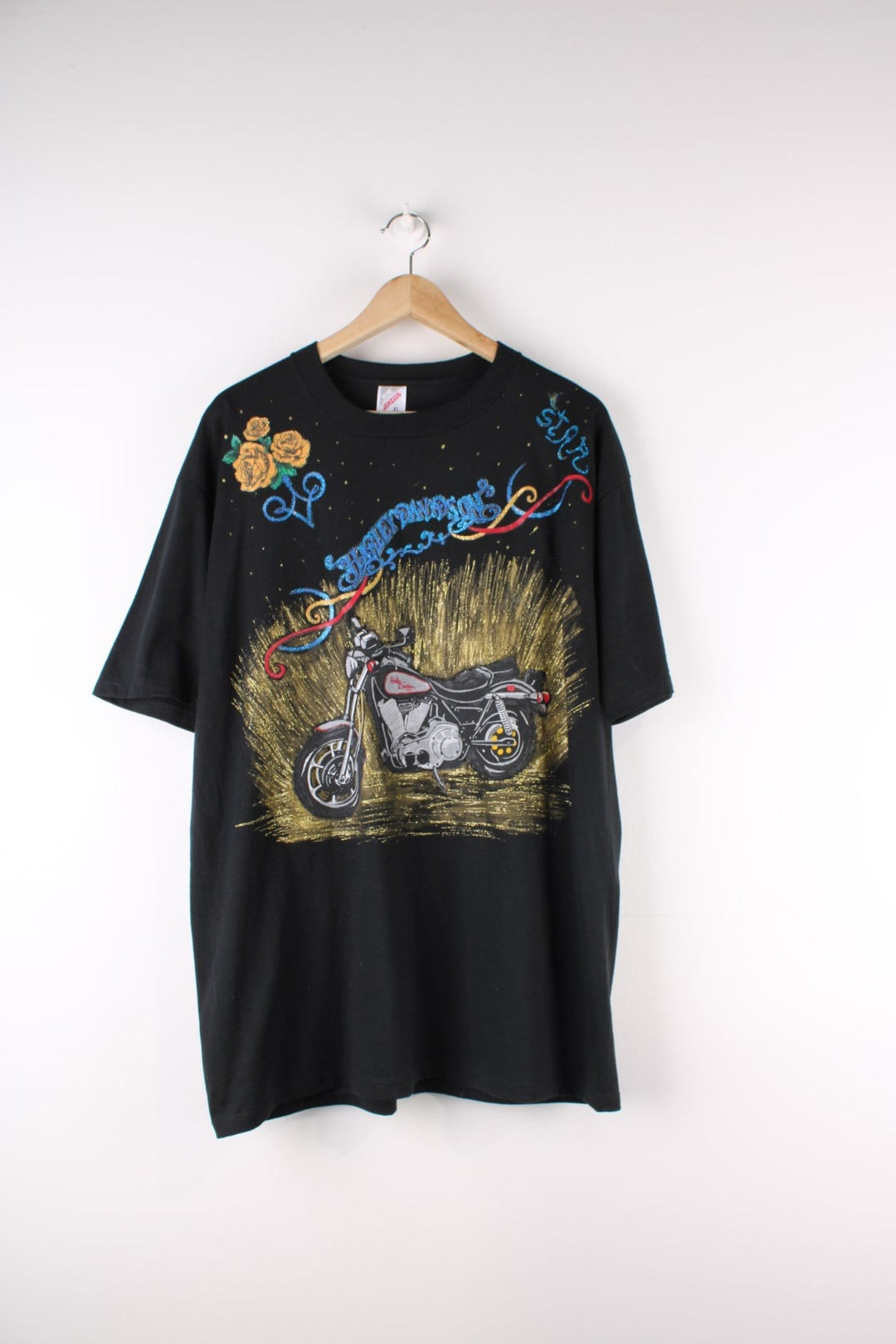 Vintage Harley-Davidson Painted T-Shirt in a black colourway with custom painted designs around printed on motorbike on the front and on the back big Harley Davidson logo and eagle.