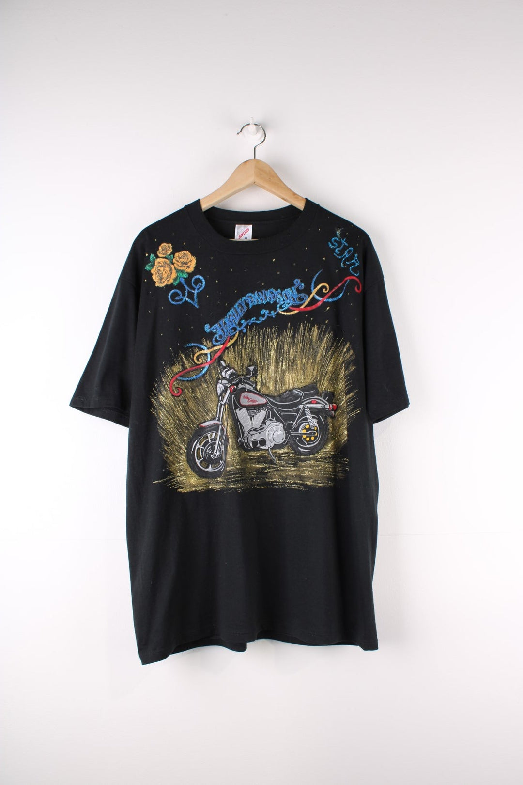 Vintage Harley-Davidson Painted T-Shirt in a black colourway with custom painted designs around printed on motorbike on the front and on the back big Harley Davidson logo and eagle.