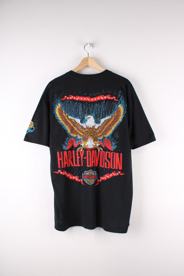 Vintage Harley-Davidson Painted T-Shirt in a black colourway with custom painted designs around printed on motorbike on the front and on the back big Harley Davidson logo and eagle.