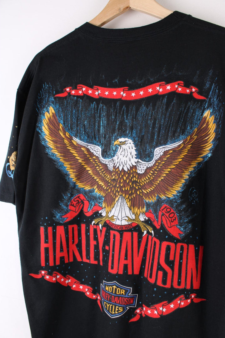 Vintage Harley-Davidson Painted T-Shirt in a black colourway with custom painted designs around printed on motorbike on the front and on the back big Harley Davidson logo and eagle.