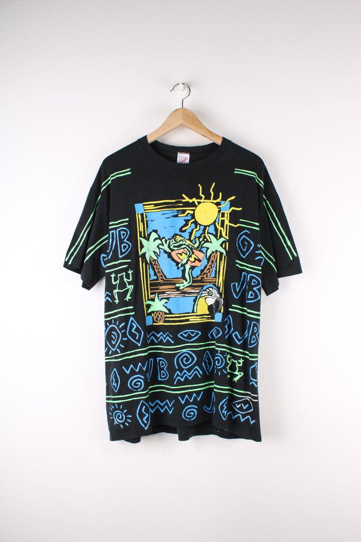 Vintage Jimmy Buffett Neon Surf Frog T-Shirt in a black colourway with neon patterns printed all over as well as surf frog graphic printed on front and on the back Jimmy Buffett spell out.