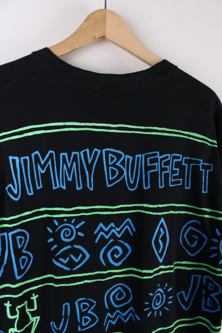 Vintage Jimmy Buffett Neon Surf Frog T-Shirt in a black colourway with neon patterns printed all over as well as surf frog graphic printed on front and on the back Jimmy Buffett spell out.