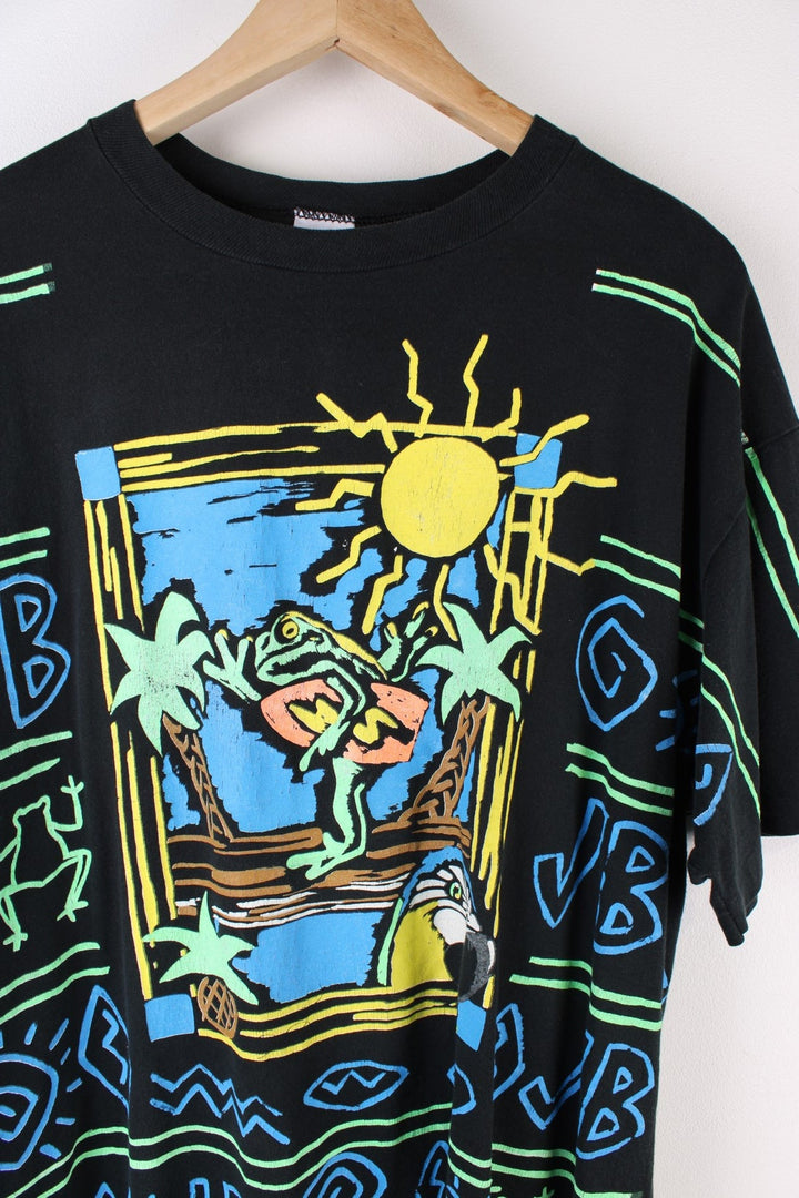 Vintage Jimmy Buffett Neon Surf Frog T-Shirt in a black colourway with neon patterns printed all over as well as surf frog graphic printed on front and on the back Jimmy Buffett spell out.