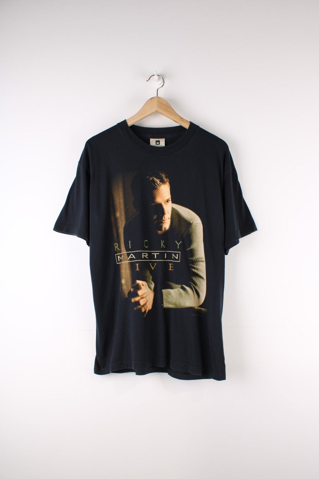 Vintage 2000 Ricky Martin Livin La Vida Loca Tour T-Shirt in a black colourway with Ricky Martin graphic printed on the front and on the back the tour locations.