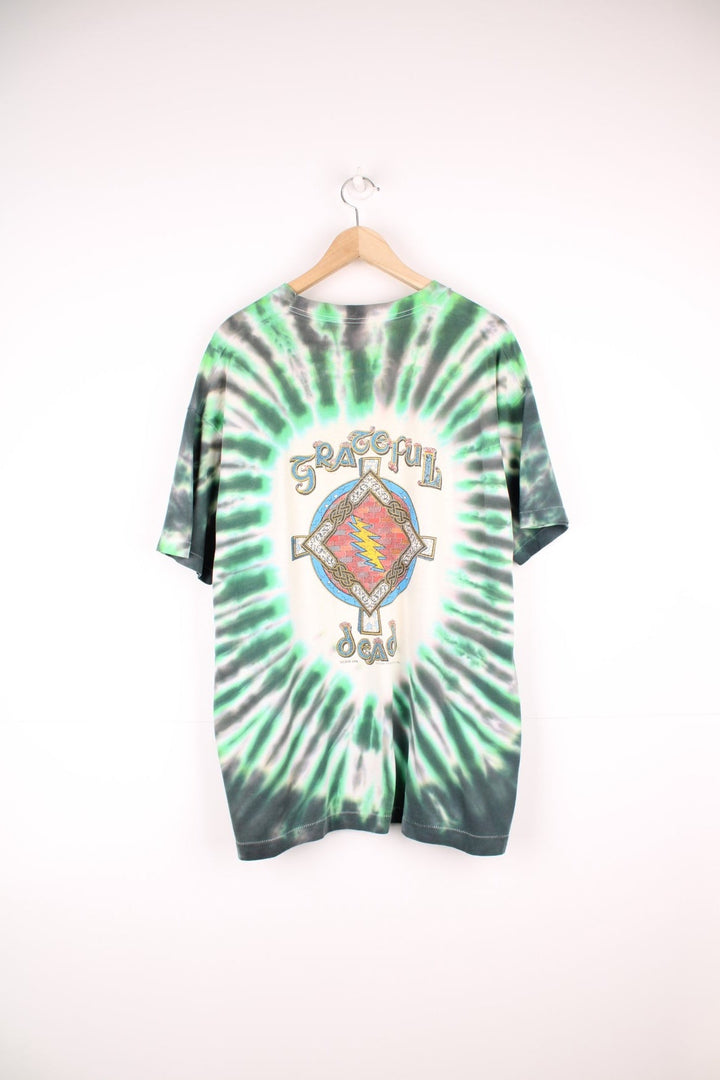 Vintage 1996 Grateful Dead Celtic Shamrock T-Shirt in a green and white tie dye colourway, skull & shamrock printed on the front and the band's name and cross printed on the back.