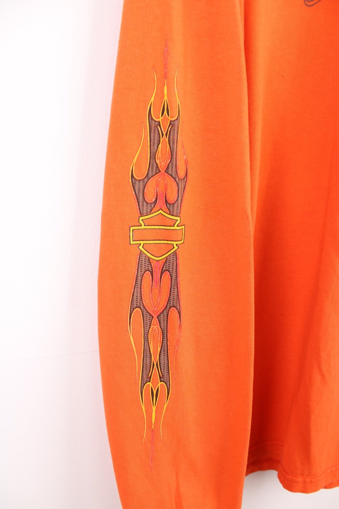 Harley-Davidson Jamestown orange long sleeve top with printed graphic on the front, back and sleeves