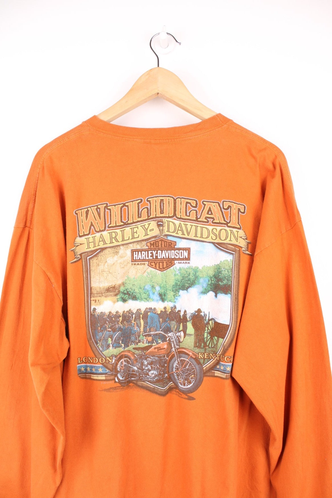 Harley-Davidson Wildcat orange long sleeve top, made in the USA. Features printed graphic on the front and back