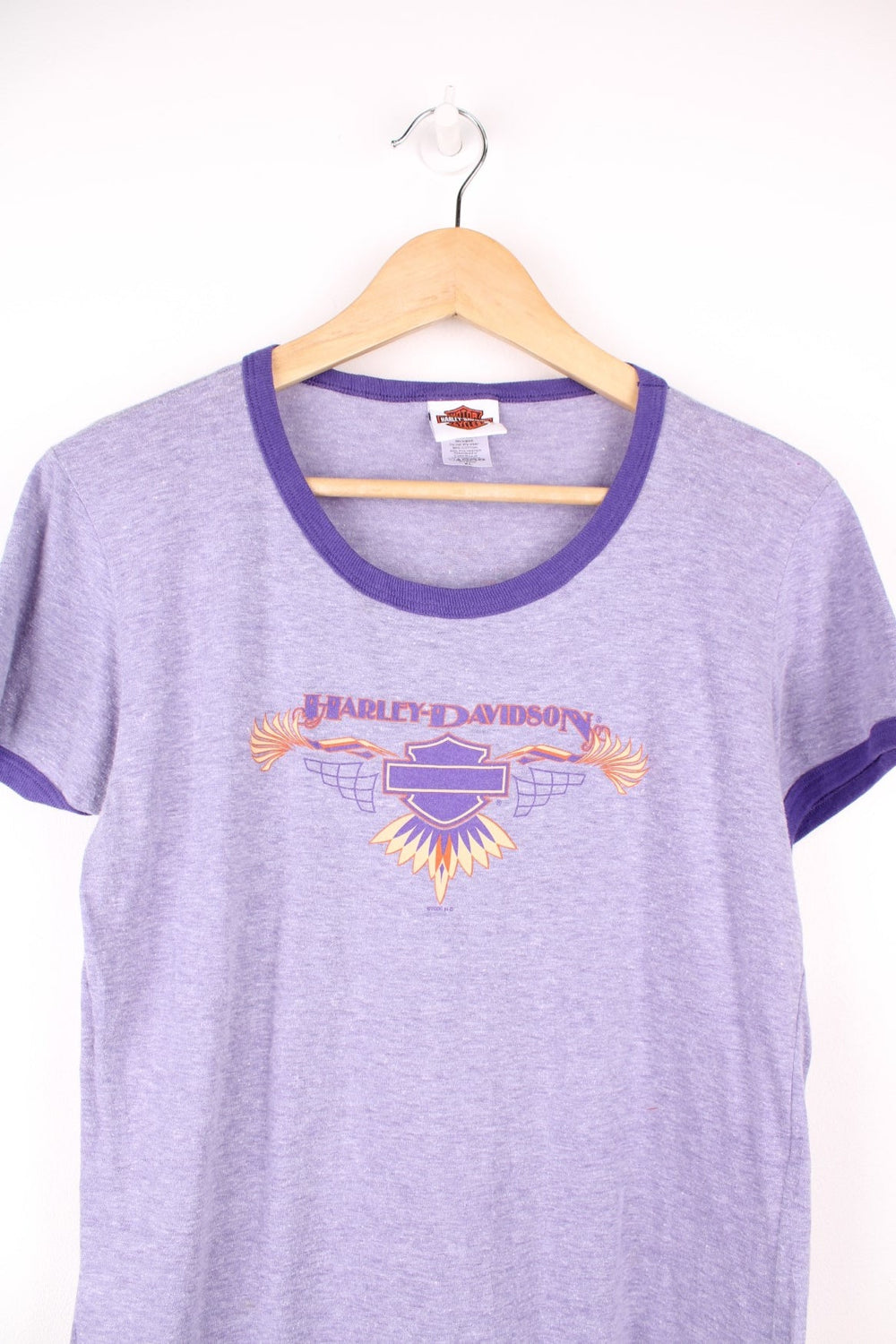 Women's Harley-Davidson ringer tee in a lilac colour way, features printed spell-out graphic on the front 