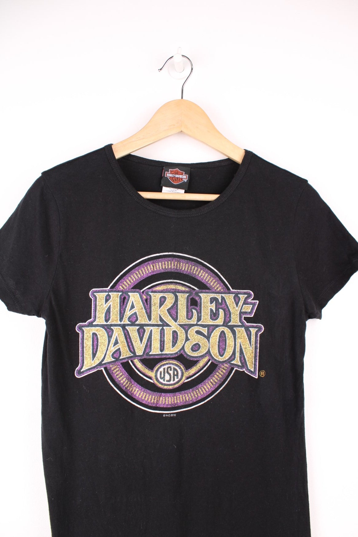 Harley-Davidson all black baby tee with glittery spell-out graphic on the front and spell-out detail below the back of the neck line