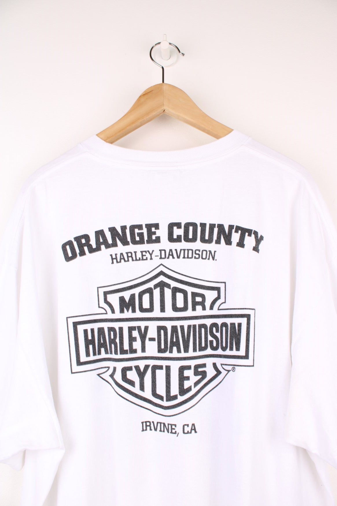 Harley-Davidson, Orange County, Irvine T-Shirt with graphic print and spell out logo on the front and back.