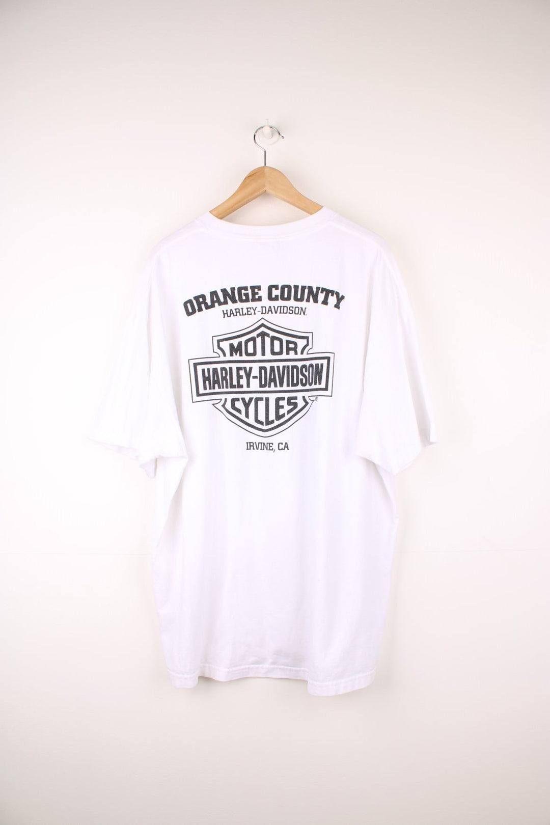 Harley-Davidson, Orange County, Irvine T-Shirt with graphic print and spell out logo on the front and back.