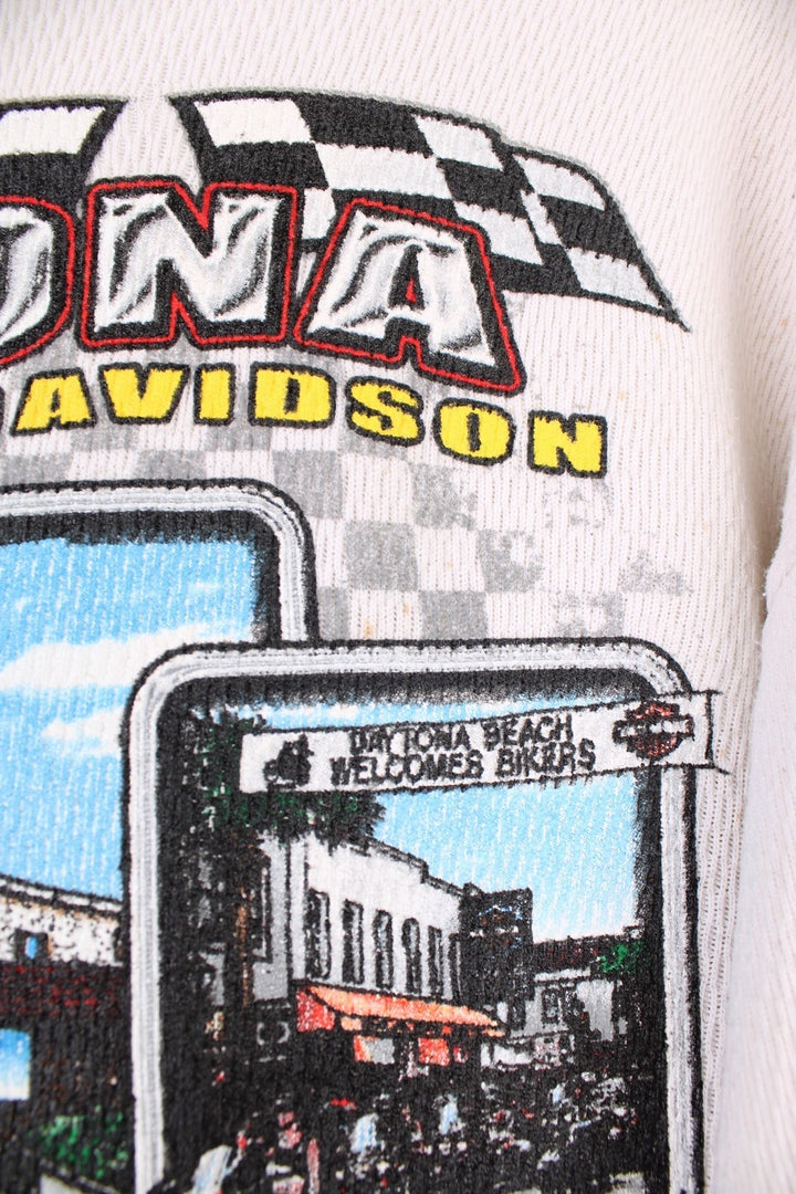 2001 Harley-Davidson, Daytona Beach, Florida long sleeved top in an off white/light beige colourway. Features printed spell out logo across the chest and graphic print on the back. 