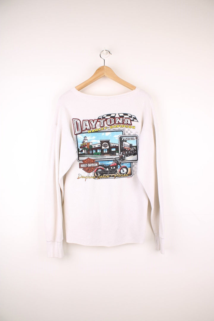 2001 Harley-Davidson, Daytona Beach, Florida long sleeved top in an off white/light beige colourway. Features printed spell out logo across the chest and graphic print on the back. 