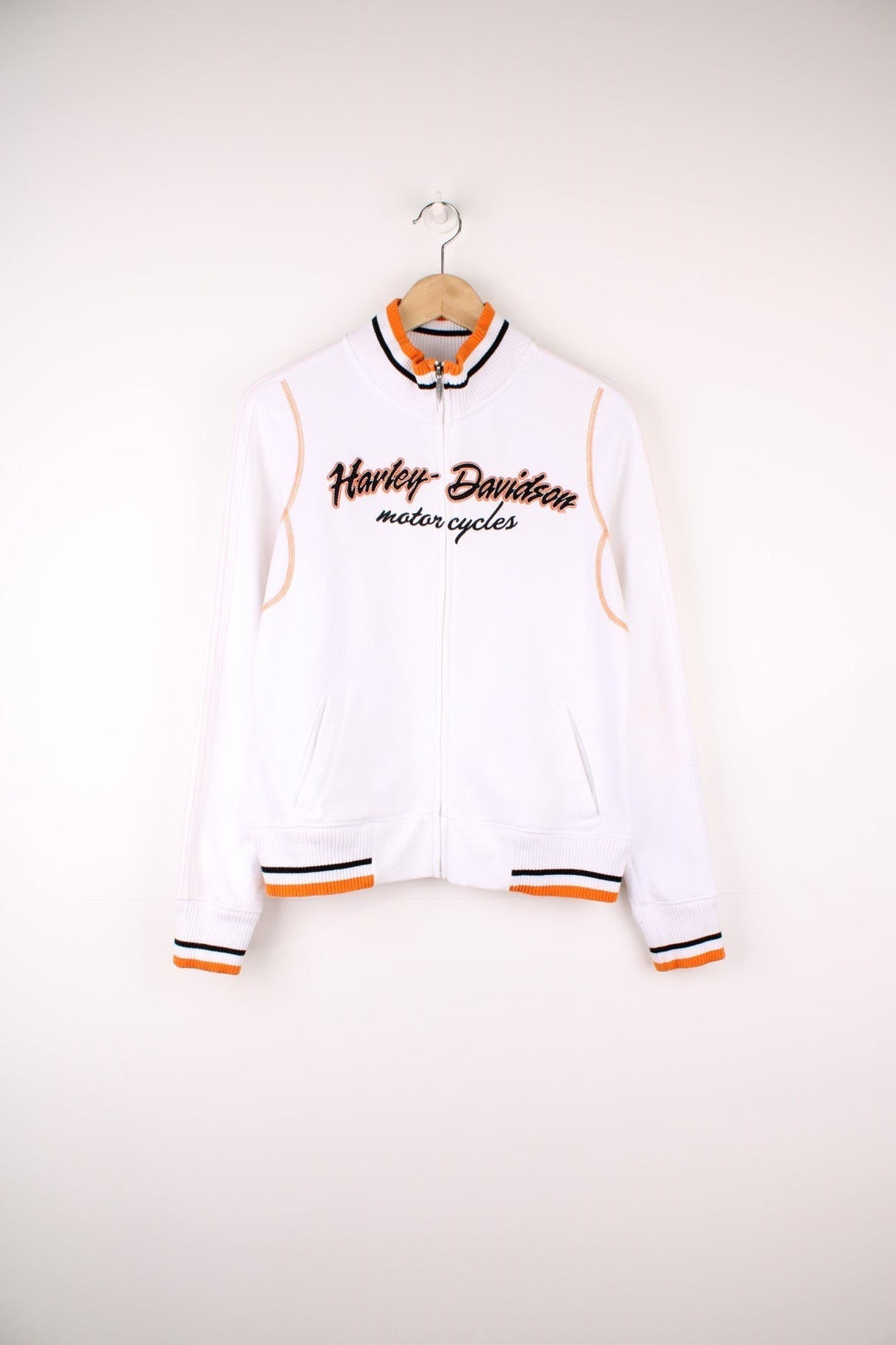 Harley-Davidson funnel neck zip through sweatshirt in a white, orange and black colourway. Features embroidered spell out logo across the chest and back.