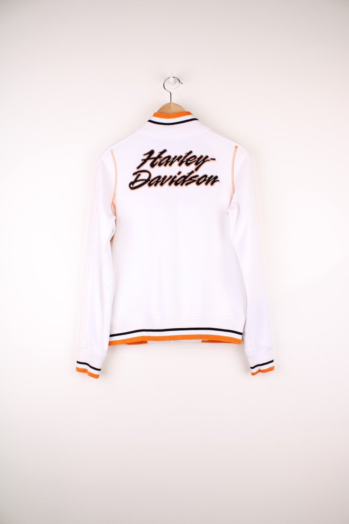 Harley-Davidson funnel neck zip through sweatshirt in a white, orange and black colourway. Features embroidered spell out logo across the chest and back.