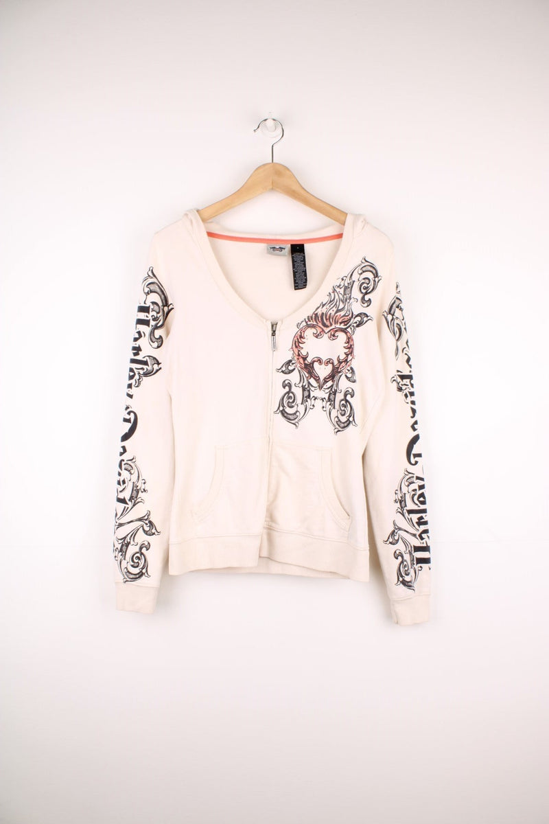 Harley-Davidson zip through hoodie with the spell out logo down each sleeve in a grey velvet puff print, and a heart pattern with pink and gold gems on the chest and back.